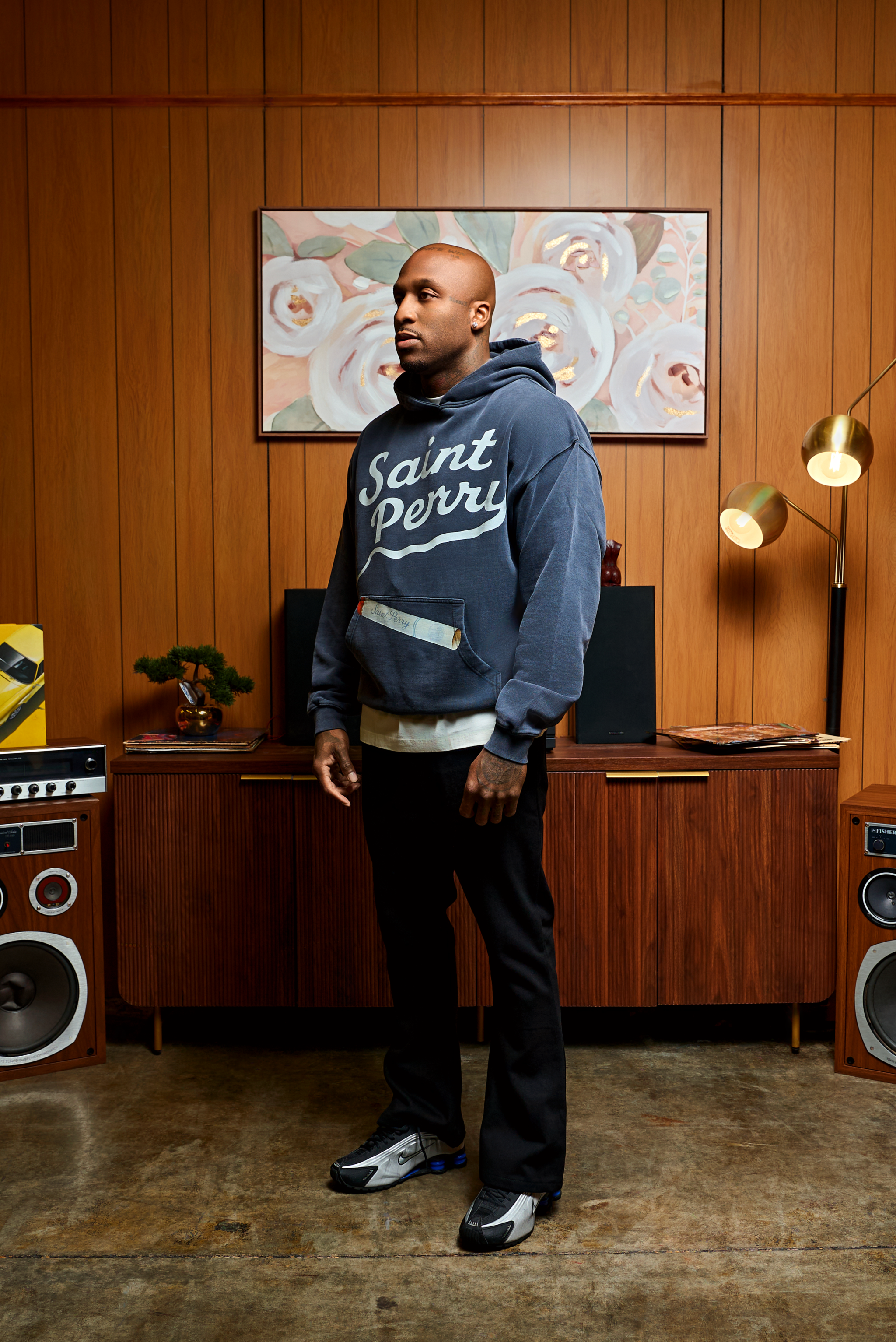 The Weight of Whispered Legends hoodie in black with bold typography and relaxed fit, made from 100% cotton