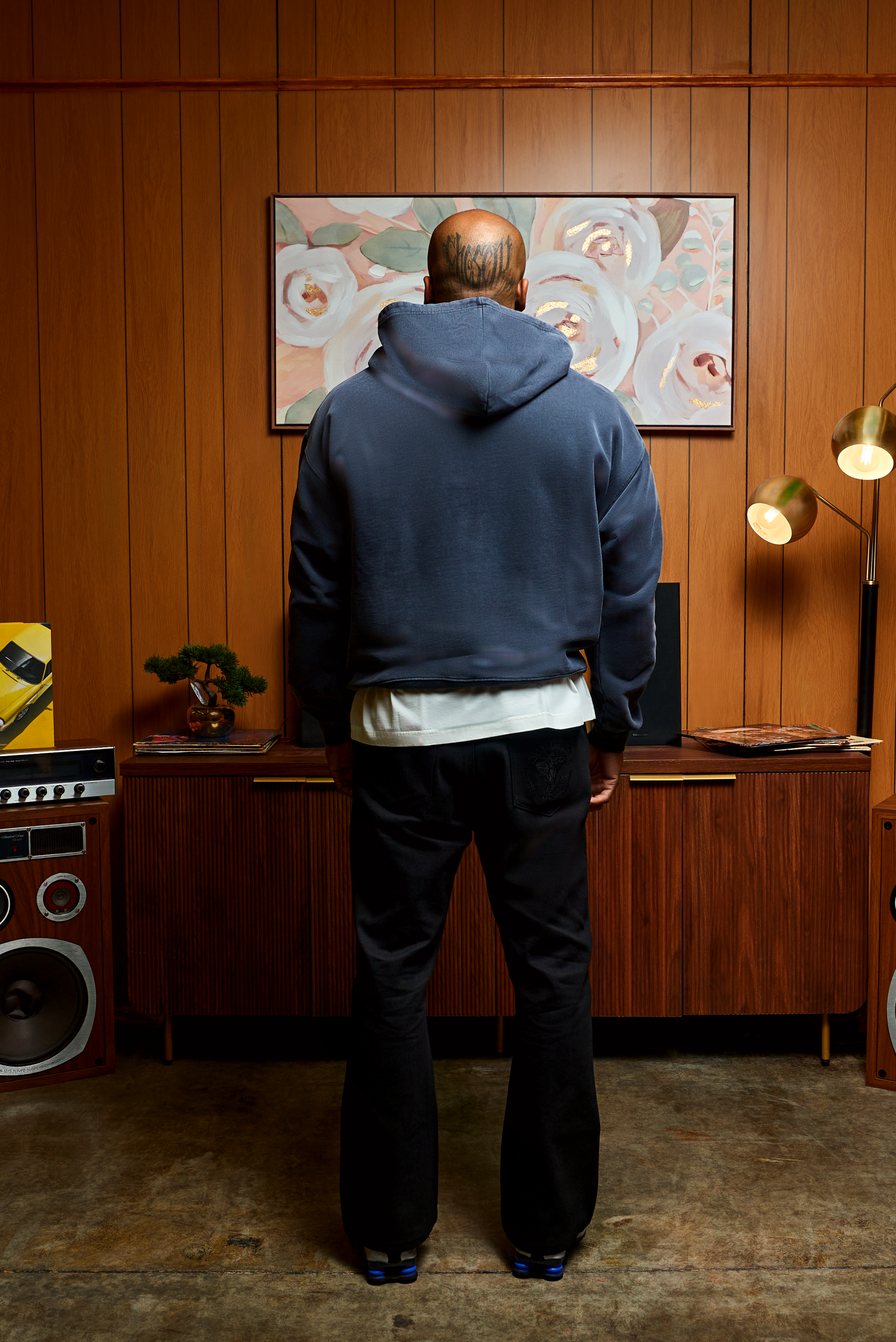 The Weight of Whispered Legends hoodie in clean architectural silhouette with bold front typography and artisanal cotton craftsmanship