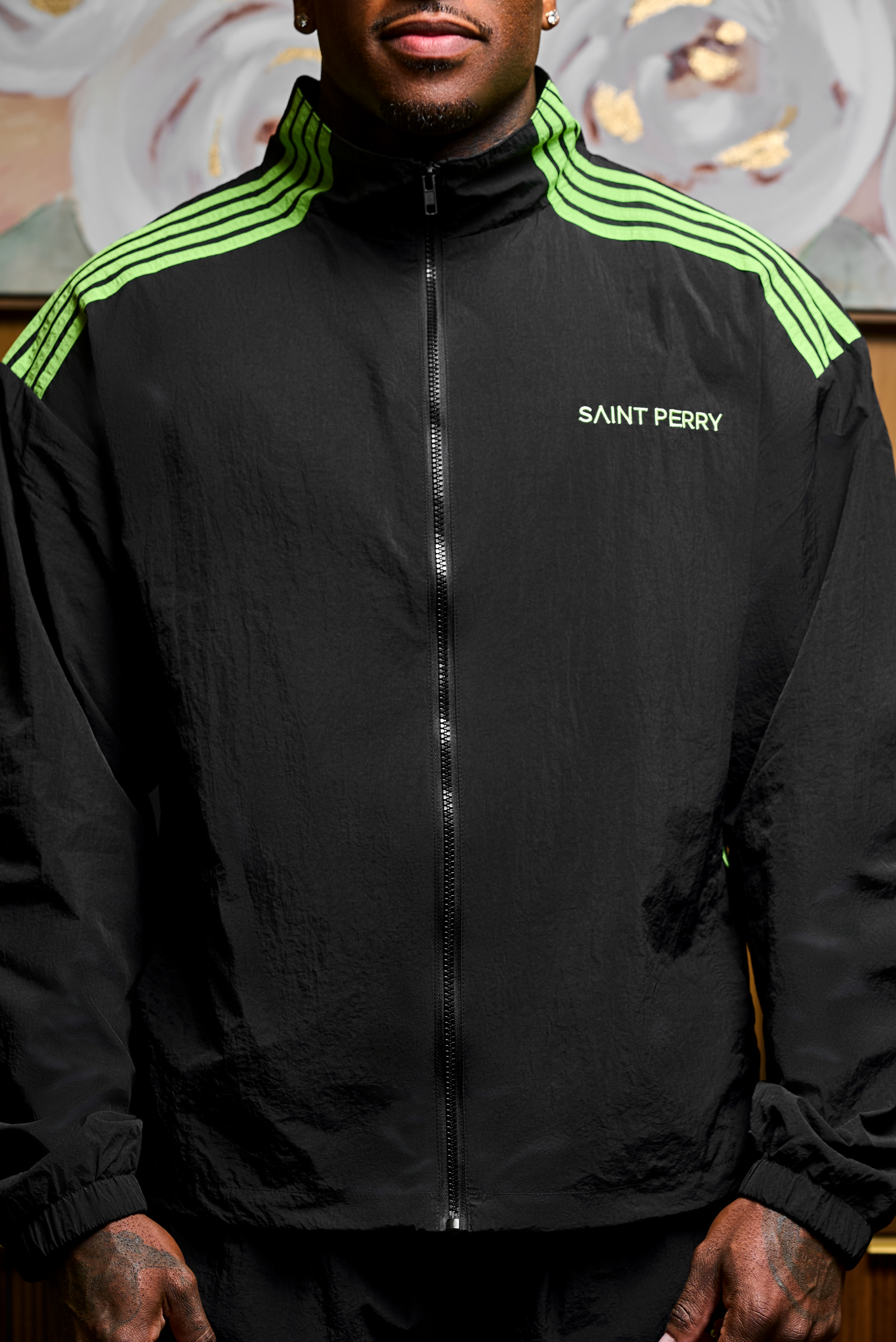 Black and neon green Otis Track Jacket and pants set with tailored athletic fit and contrast paneling by Saint Perry
