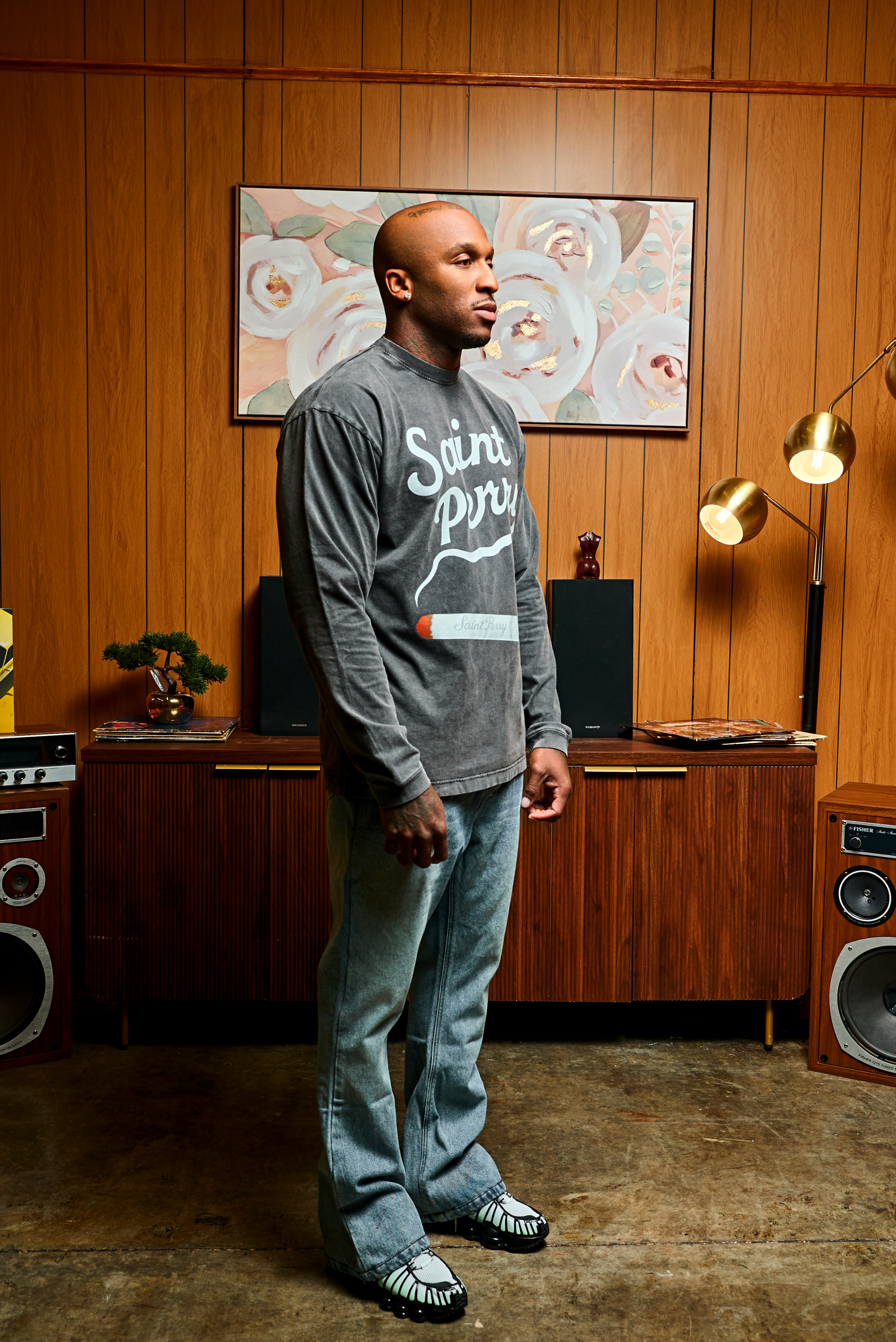 The Weight of Whispered Legends black long-sleeve with bold front typography and relaxed fit