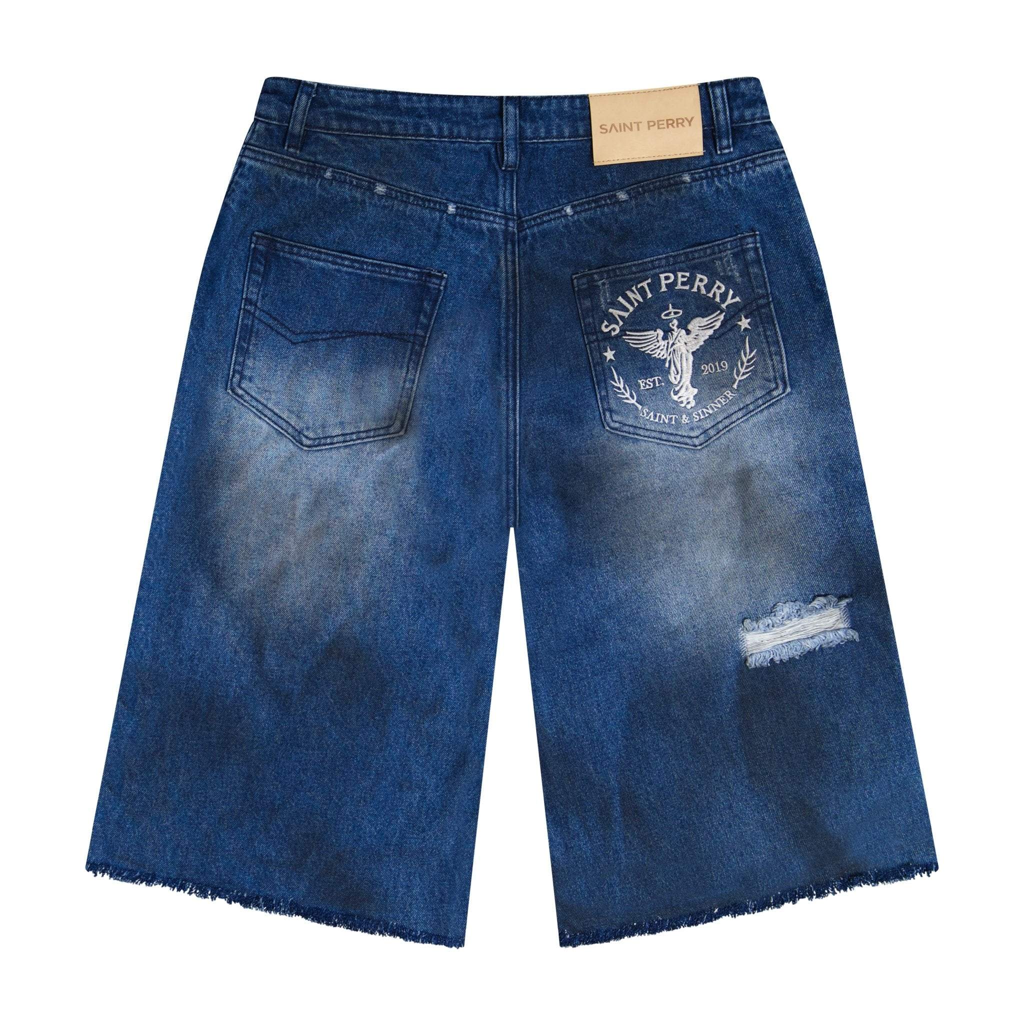 Distressed effect short denim shorts with ripped detailing and embroidered logo in blue wash