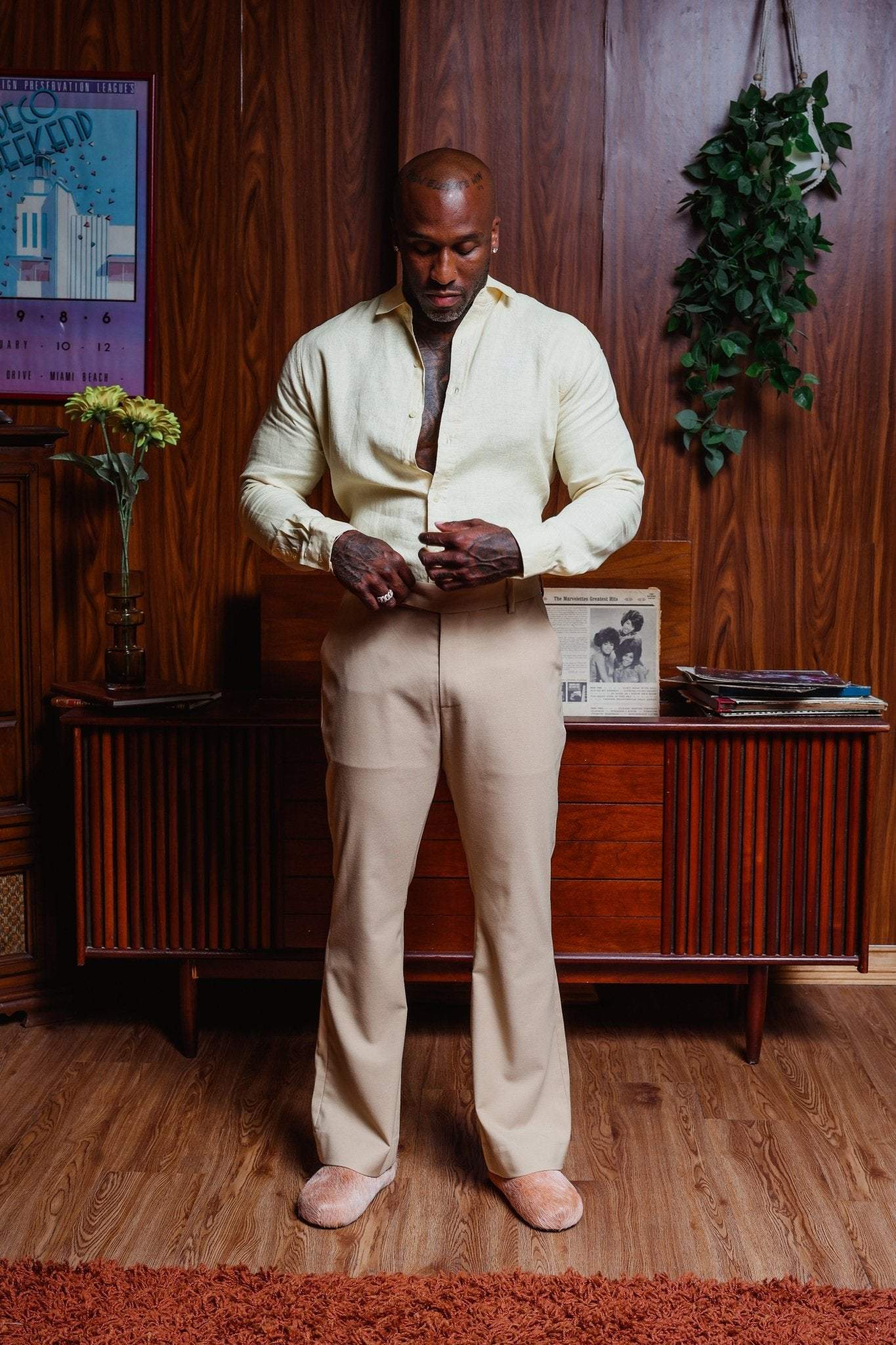 Beige flare wool pants with tailored fit and flared leg, made by Saint Perry