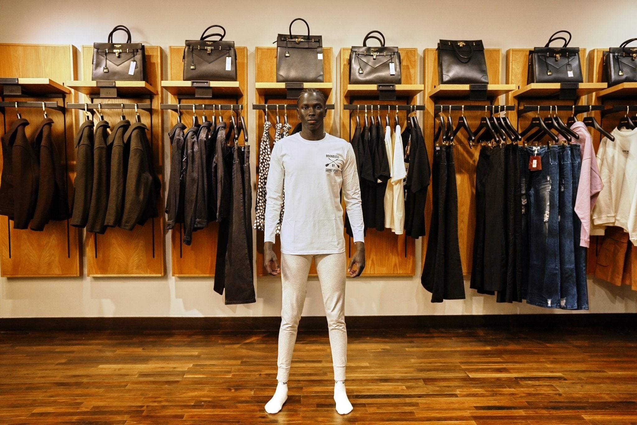 White long sleeve crewneck t-shirt with relaxed fit and minimalist design