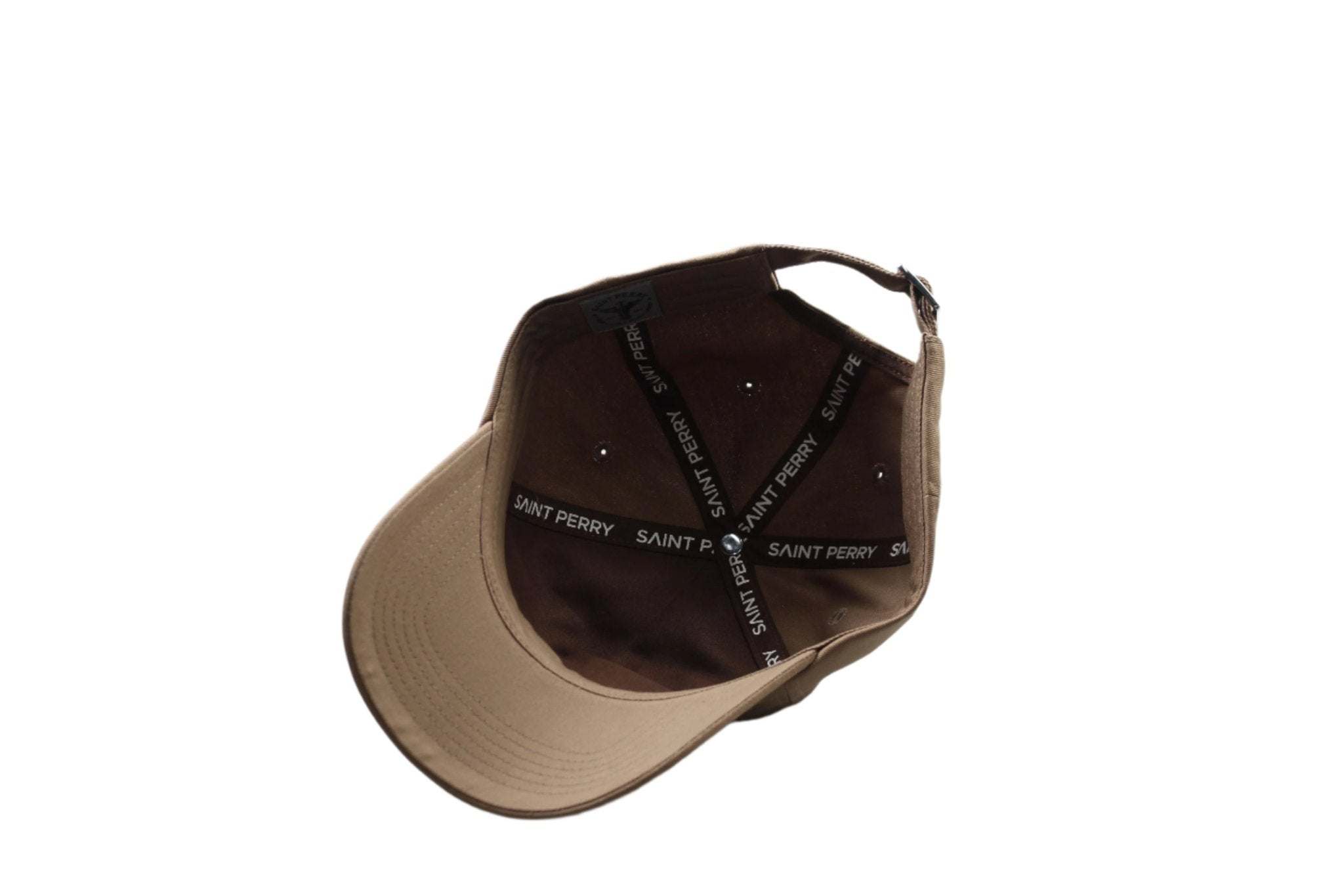Saint Perry tan baseball hat with embroidered logo and adjustable strap